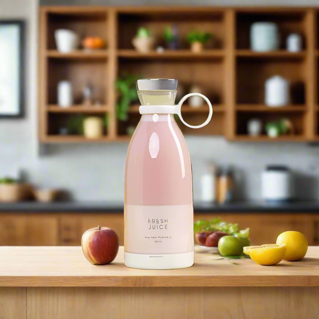 Pink juice blender bottle on a kitchen counter
